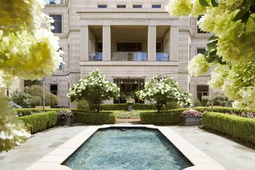 a swimming pool in front of a building at Waldorf Astoria Atlanta Buckhead in Atlanta