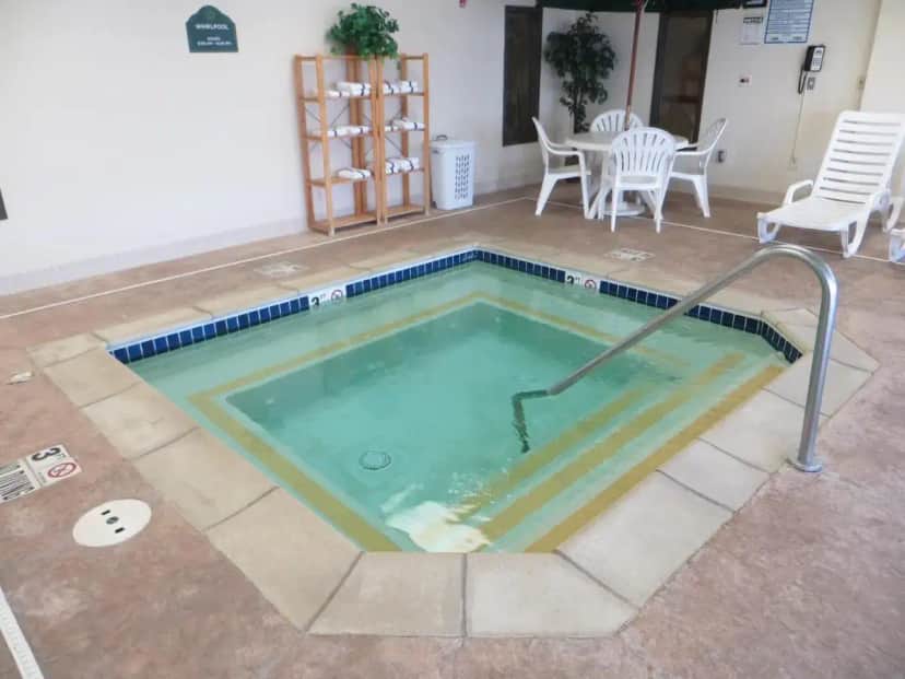 a jacuzzi tub in the middle of a patio at Wingate by Wyndham Peoria - Complimentary Area Shuttle in Peoria