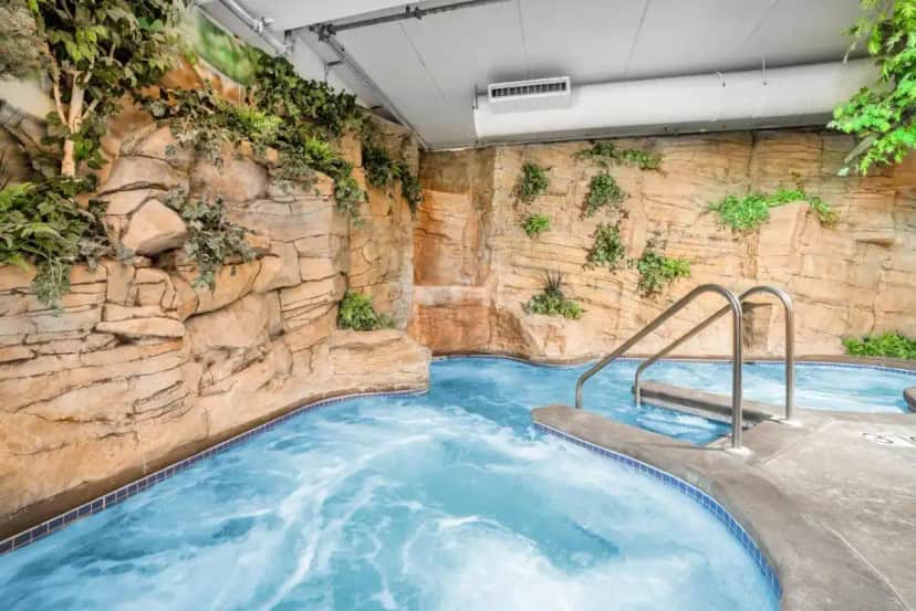 a large hot tub in a stone wall at Wyndham Garden Otsego-Minneapolis in Otsego