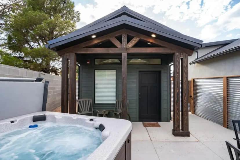 a hot tub on the patio of a house at Zion Oasis Rentals in Hurricane