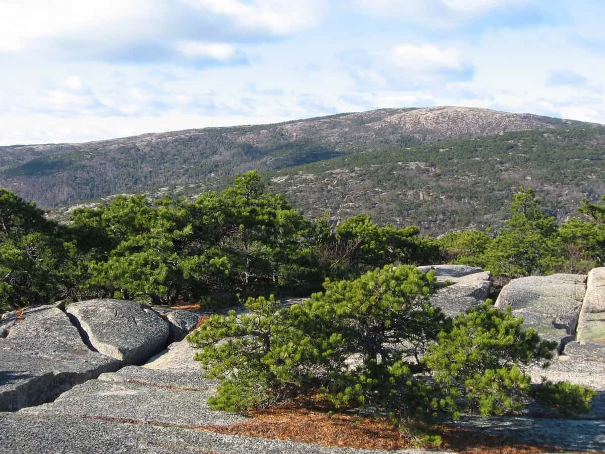 Sunrise over the granite summit of Cadillac Mountain in Acadia National Park