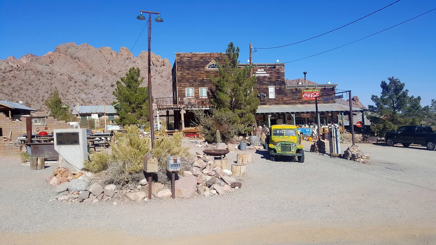 Wooden visitor buildings and an old truck at the Nelson ghost-town attraction in Eldorado Canyon, photographed in 2017